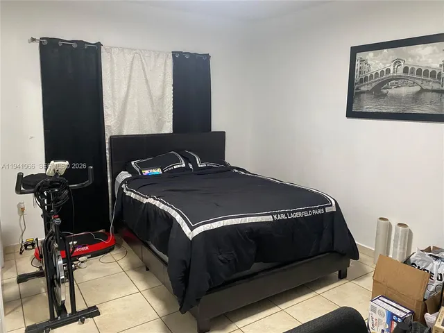 a bedroom with a bed and dresser