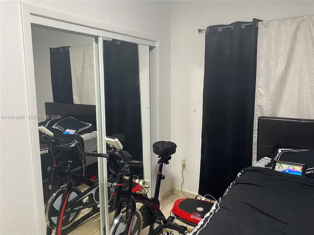 a bedroom with a bed and a closet