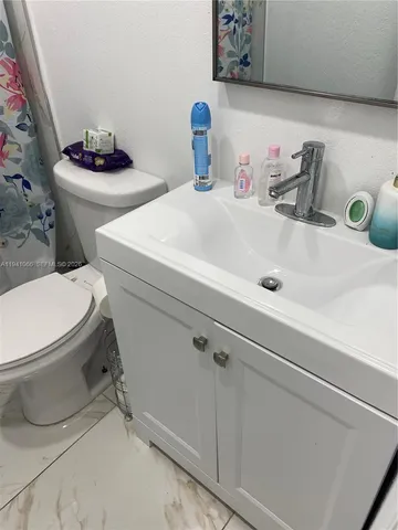 a bathroom with a sink and a toilet