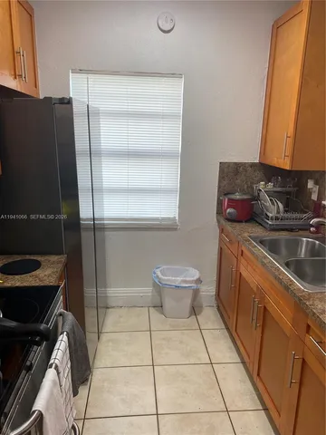 a bathroom with a sink a toilet and a tub