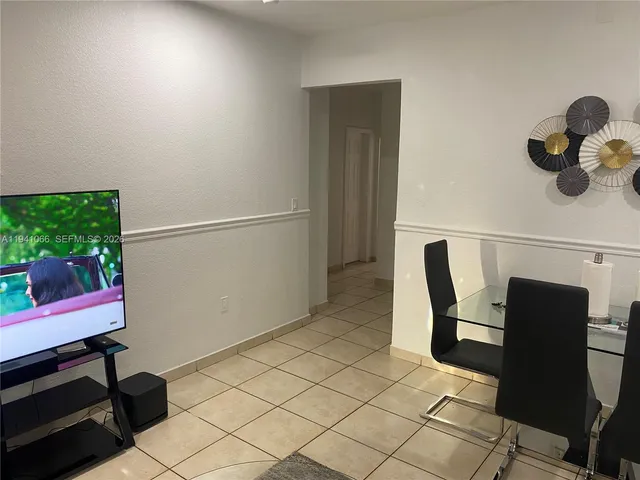 a view of dining room with furniture and wooden floor