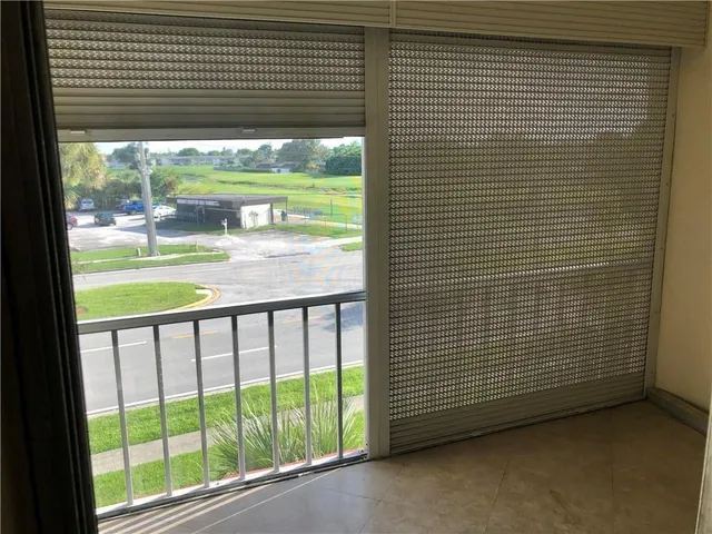 a view of a room with window and floor to ceiling window