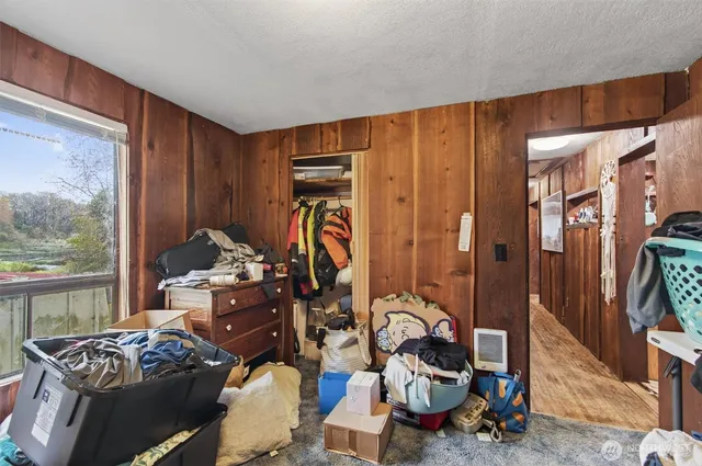 a bedroom with furniture and a window