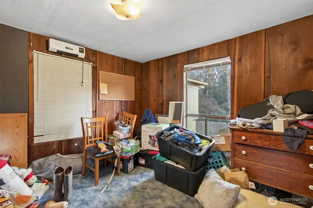 a bed room with furniture and a window