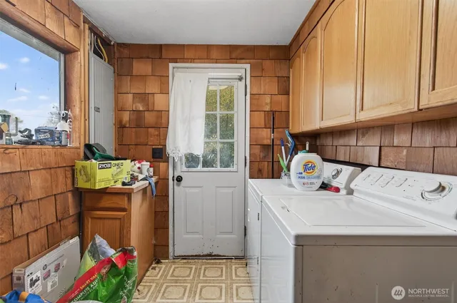 a utility room with dryer and washer