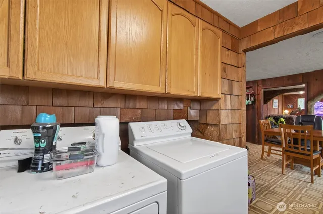 a kitchen with a refrigerator and cabinets