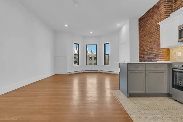a view of a kitchen with a sink cabinets and window