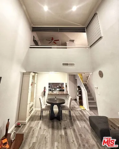 a view of deck and living room with wooden floor
