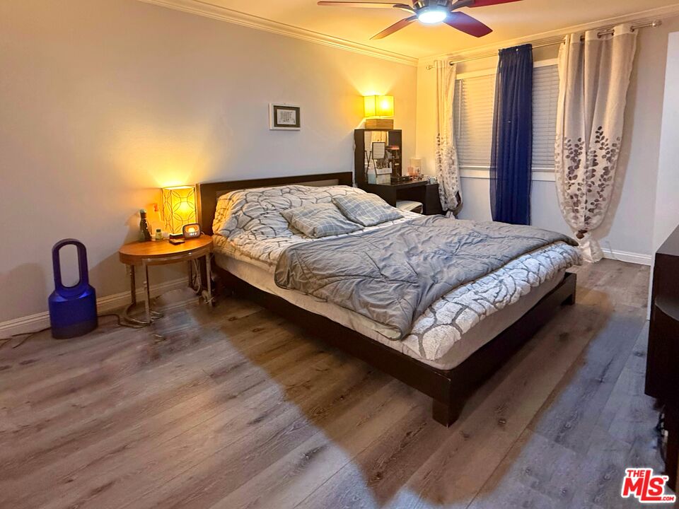 1118 Valencia Street, Unit 320 Los Angeles, CA 90015 - Photo 12 of 24 a bedroom with a bed and window