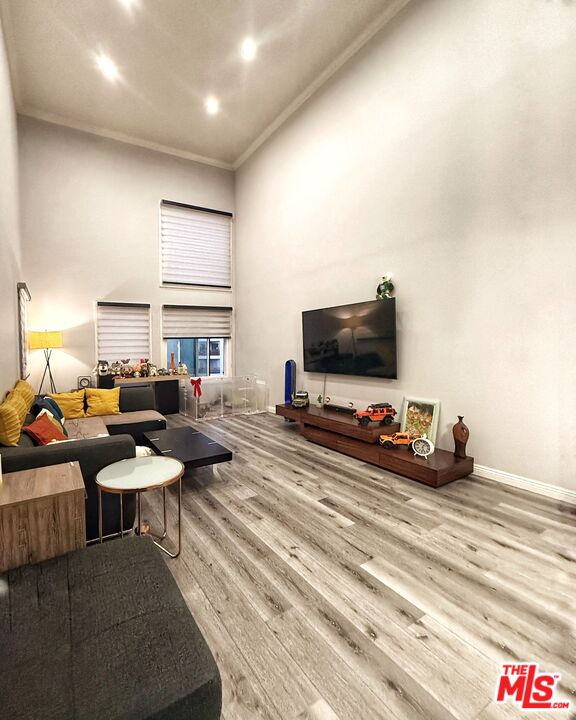 1118 Valencia Street, Unit 320 Los Angeles, CA 90015 - Photo 3 of 24 a living room with furniture and a flat screen tv