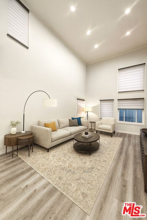 1118 Valencia Street, Unit 320 Los Angeles, CA 90015 - Photo 5 of 24 a living room with furniture and a table