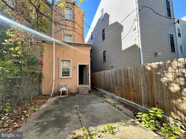 a view of a house with a small yard