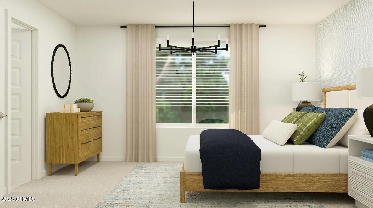 9552 West Piccadilly Road Phoenix, AZ 85037 - Photo 9 of 19 a bedroom with a bed and a chandelier