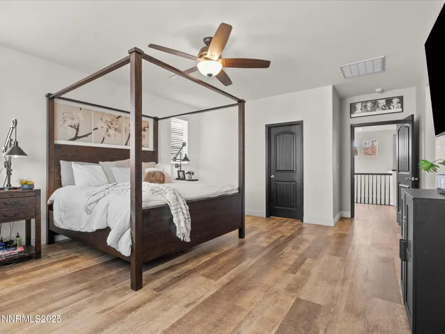 a bed room with a bed and a mirror