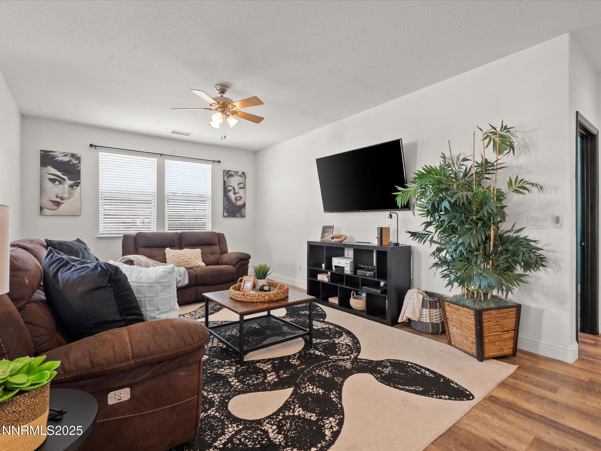 2135 Horse Prairie Road Reno, NV 89521 - Photo 15 of 32 a living room with furniture a flat screen tv and a large window