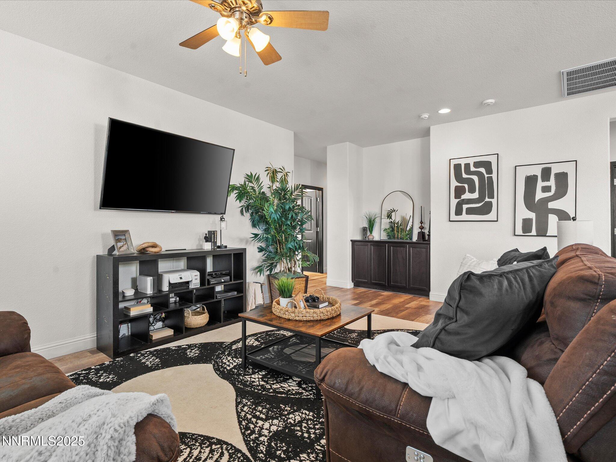2135 Horse Prairie Road Reno, NV 89521 - Photo 16 of 32 a living room with furniture and a flat screen tv