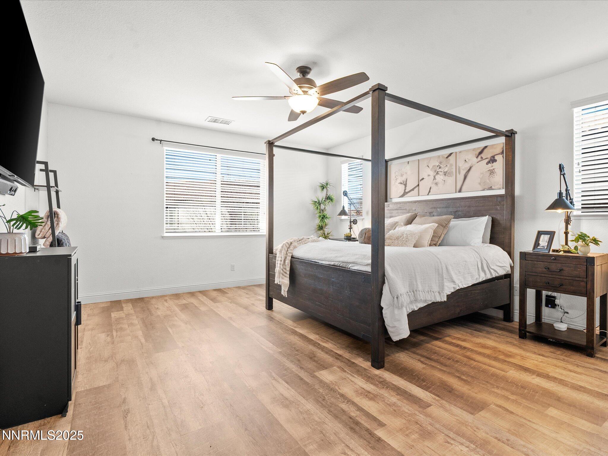 2135 Horse Prairie Road Reno, NV 89521 - Photo 17 of 32 a bedroom with a bed table closet and a window