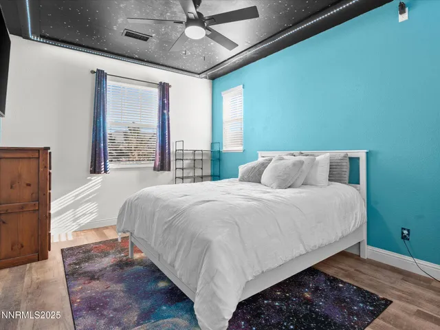 a bedroom with a large bed and a large window