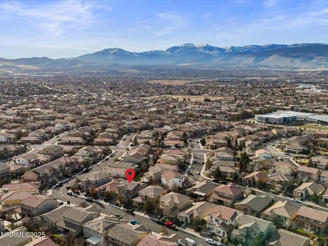 an aerial view of residential house and green space