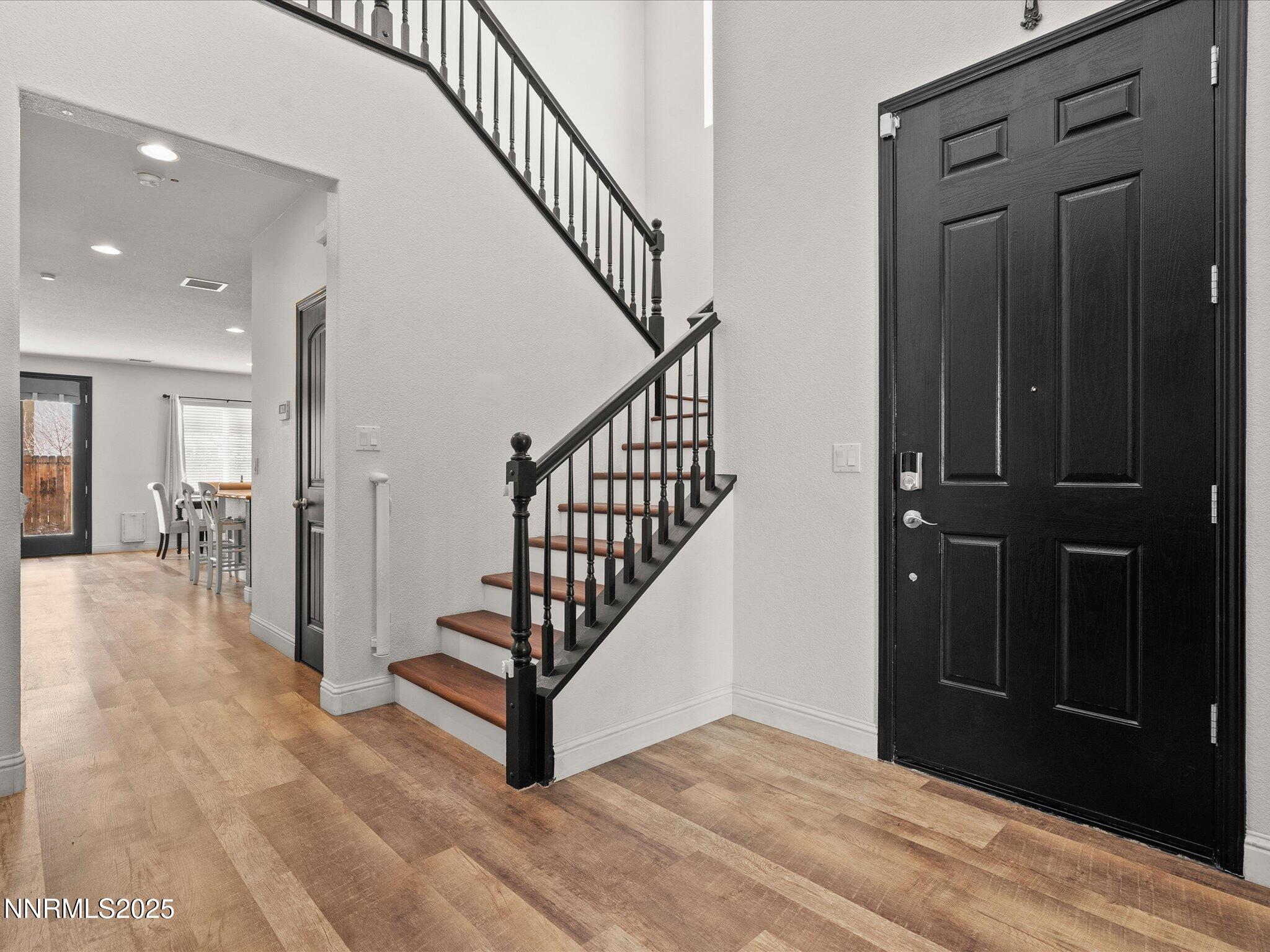 2135 Horse Prairie Road Reno, NV 89521 - Photo 6 of 32 a view of a hallway with a door and stairs