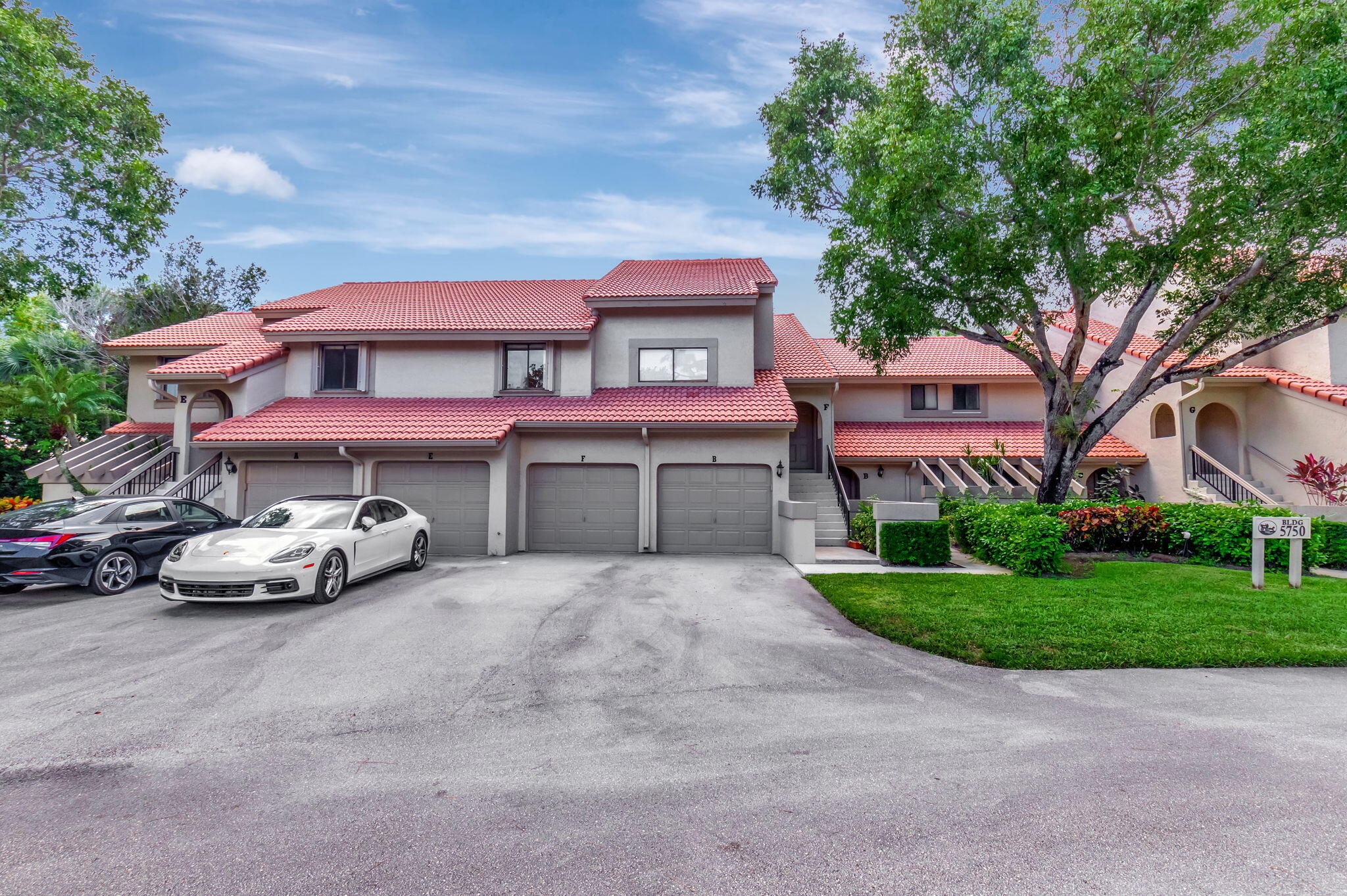 5750 Coach House Circle, Unit E Boca Raton, FL 33486 - Photo 3 of 44 ONE CAR GARAGE AND DRIVEWAY PARKING