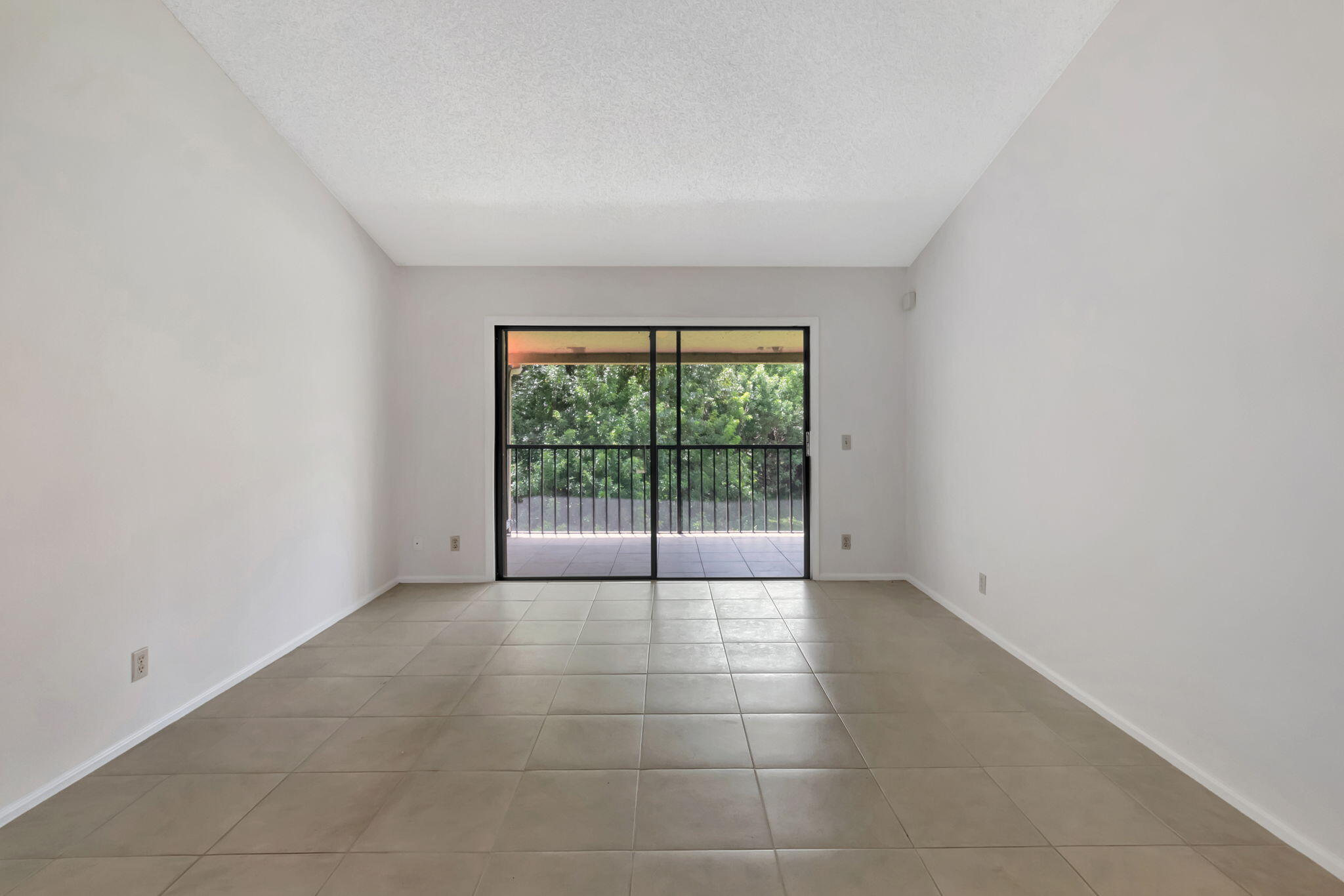 5750 Coach House Circle, Unit E Boca Raton, FL 33486 - Photo 8 of 44 FORMAL LIVING ROOM LEADS TO BALCONY