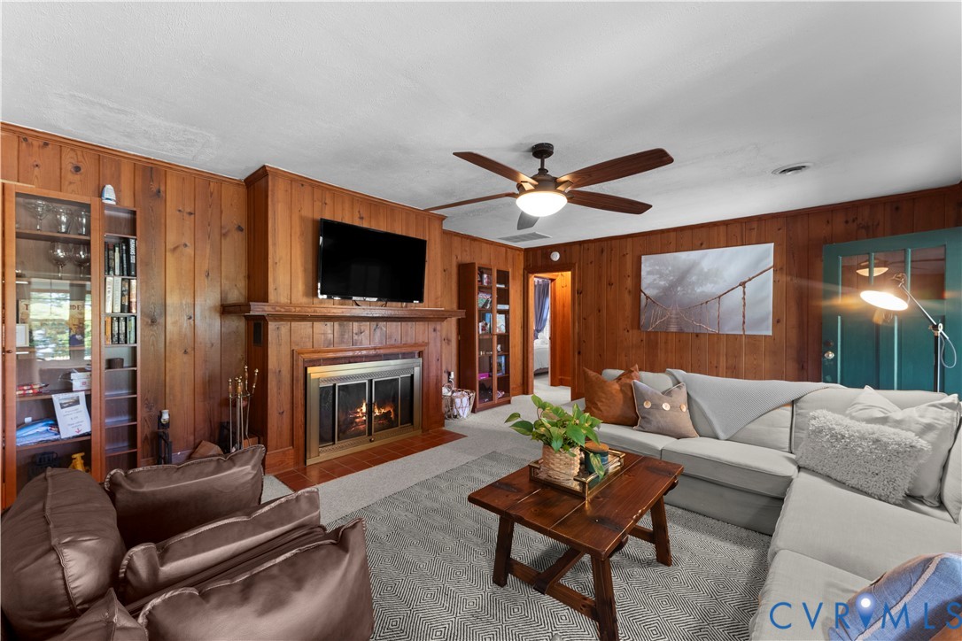 437 Plainview Road Kinsale, VA 22488 - Photo 34 of 63 a living room with furniture a fireplace and a flat screen tv