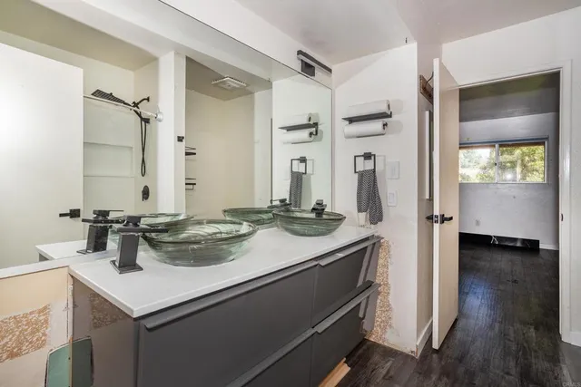 a bathroom with a sink and a mirror