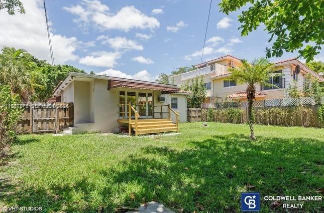 3350 Southwest 29th Street Miami, FL 33133 - Photo 2 of 15 a view of a house with backyard and a garden