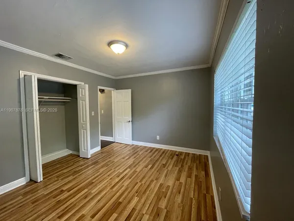 a view of wooden floor in an empty room