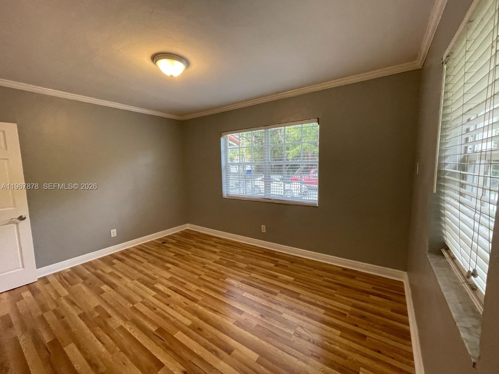 3350 Southwest 29th Street Miami, FL 33133 - Photo 10 of 15 a view of an empty room and window