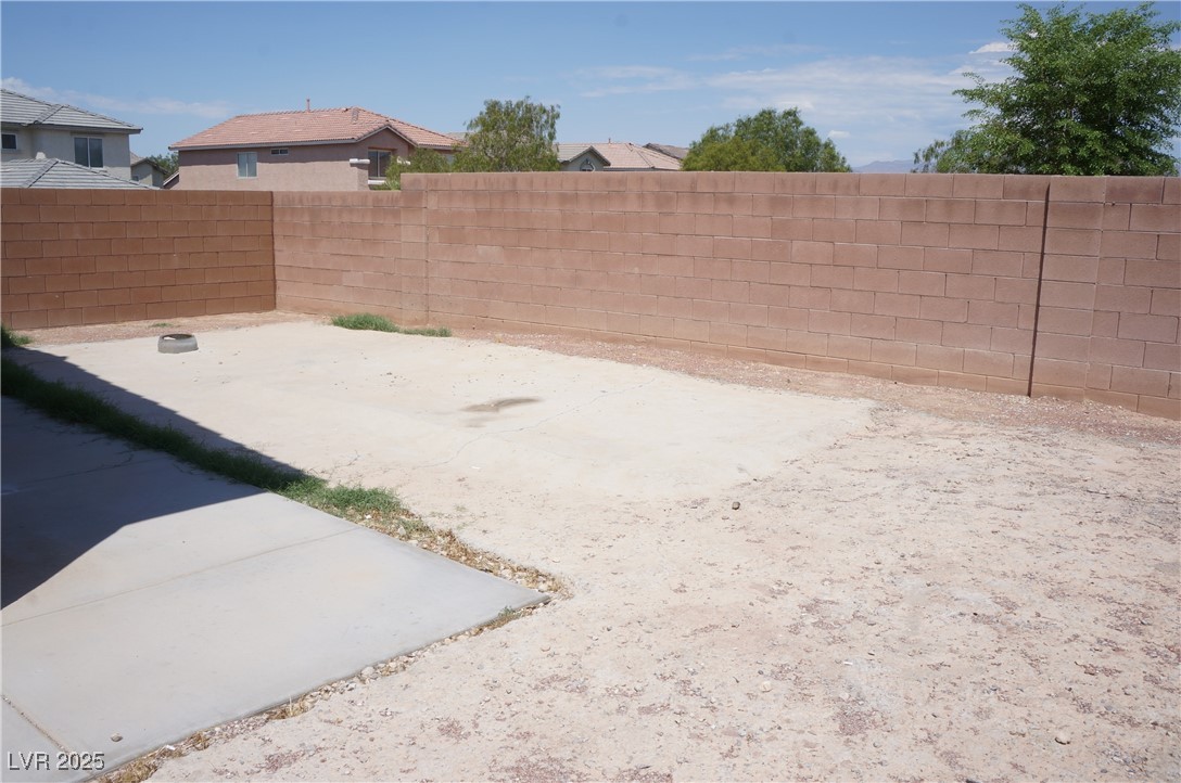 6148 Bluehill Avenue, Unit 2 Las Vegas, NV 89156 - Photo 13 of 13 Fenced backyard featuring a patio