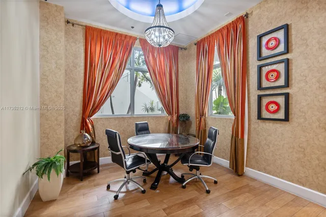 a view of a dining room with furniture window and wooden floor