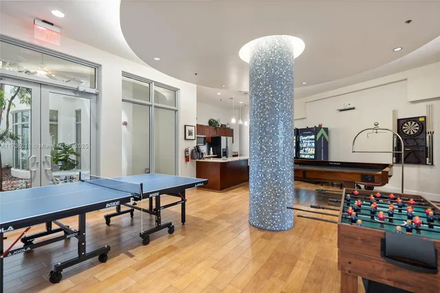 a room with lots of furniture and chandelier