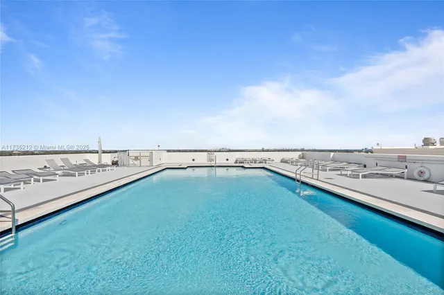 a view of a swimming pool and an ocean view