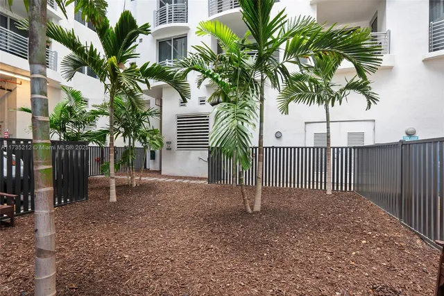a view of a backyard with a garden