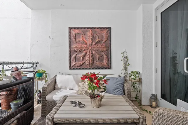 a dining room with furniture and flowers