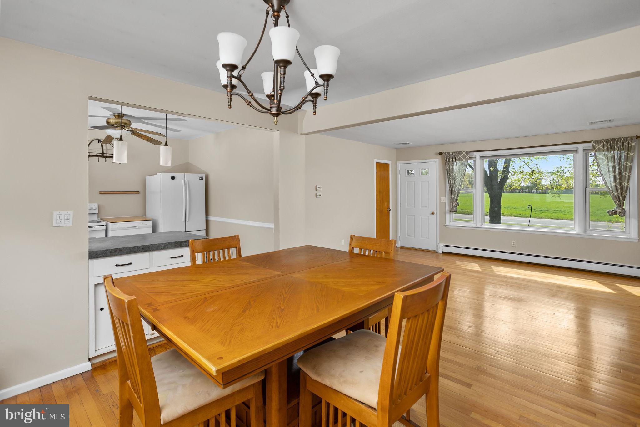 892 Monmouth Road Cream Ridge, NJ 08514 - Photo 8 of 24 a view of a dining room with furniture window and wooden floor