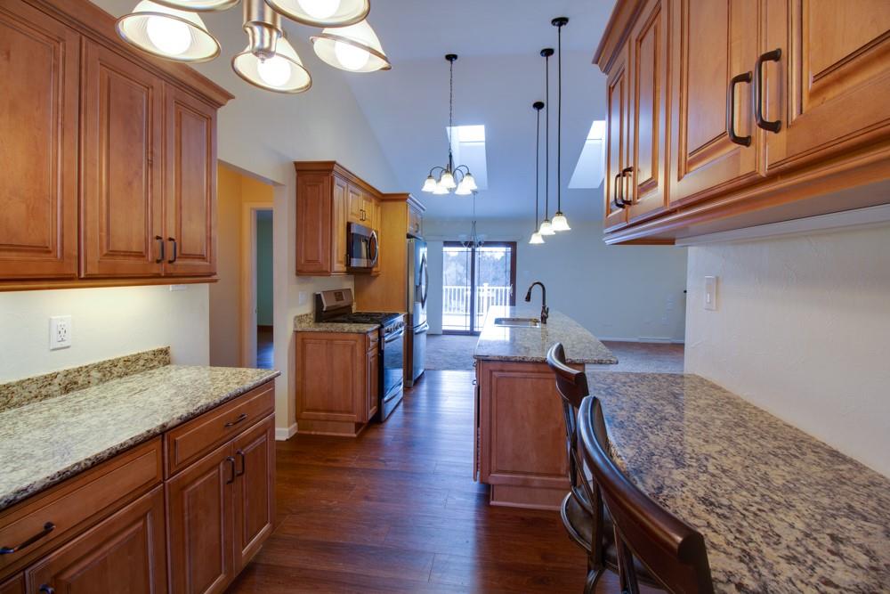 79 Windcrest Drive Cecil, PA 15321 - Photo 3 of 19 a kitchen with granite countertop lots of counter space and wooden floor