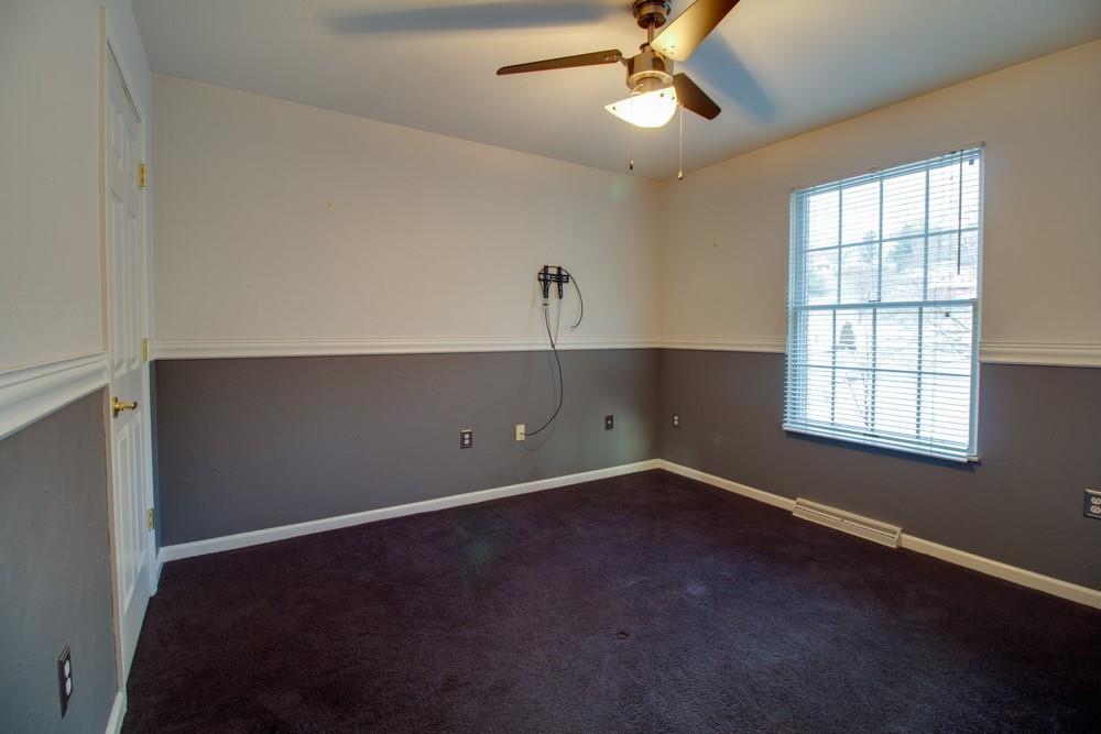 79 Windcrest Drive Cecil, PA 15321 - Photo 5 of 19 an empty room with windows and fan