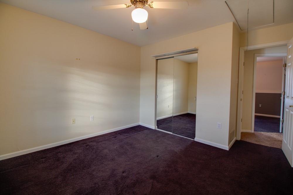 79 Windcrest Drive Cecil, PA 15321 - Photo 6 of 19 an empty room with closet and a chandelier fan