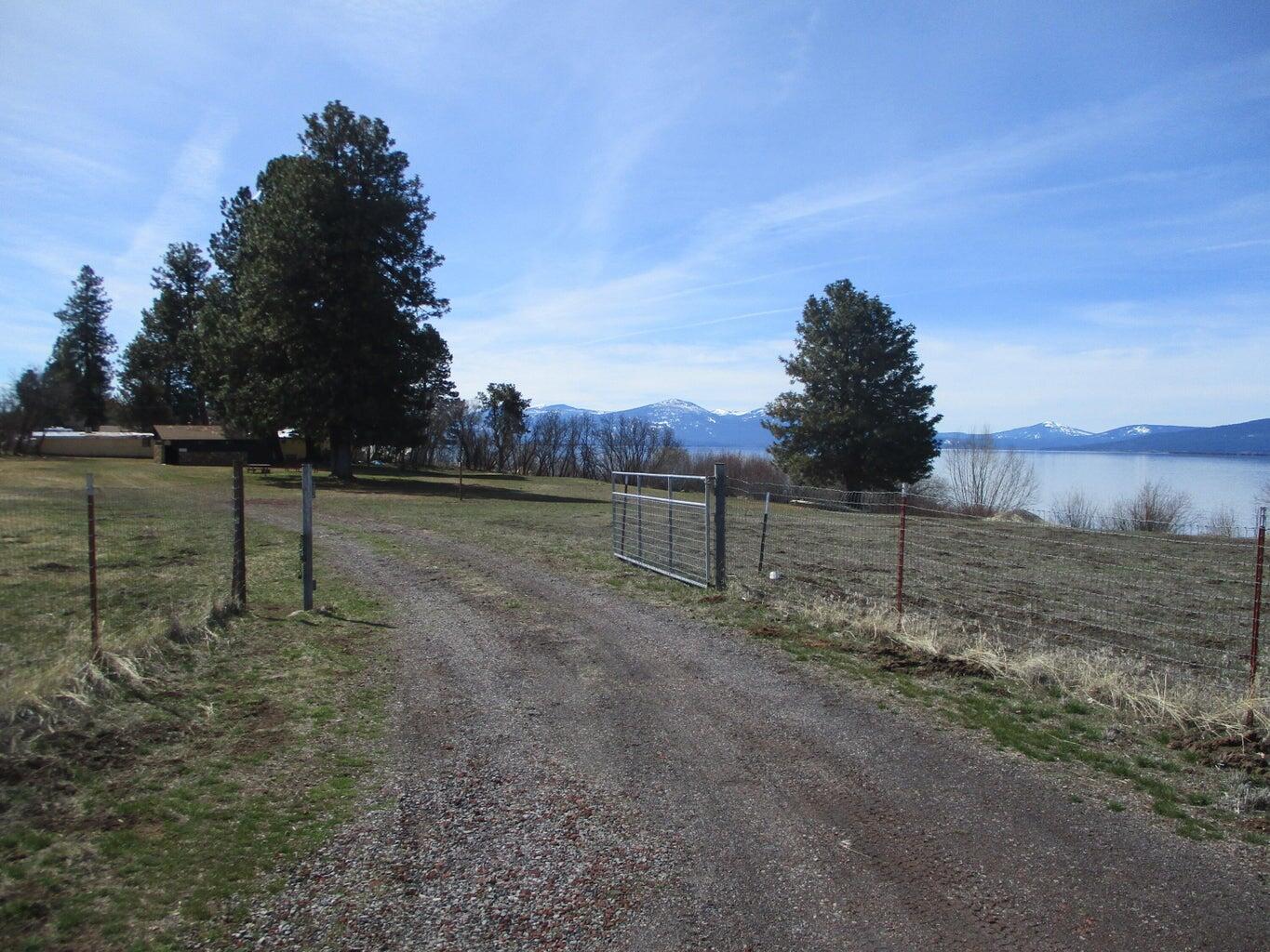 Shoreview Drive Chiloquin, OR 97624 - Photo 10 of 12 a view of a field with trees in the background