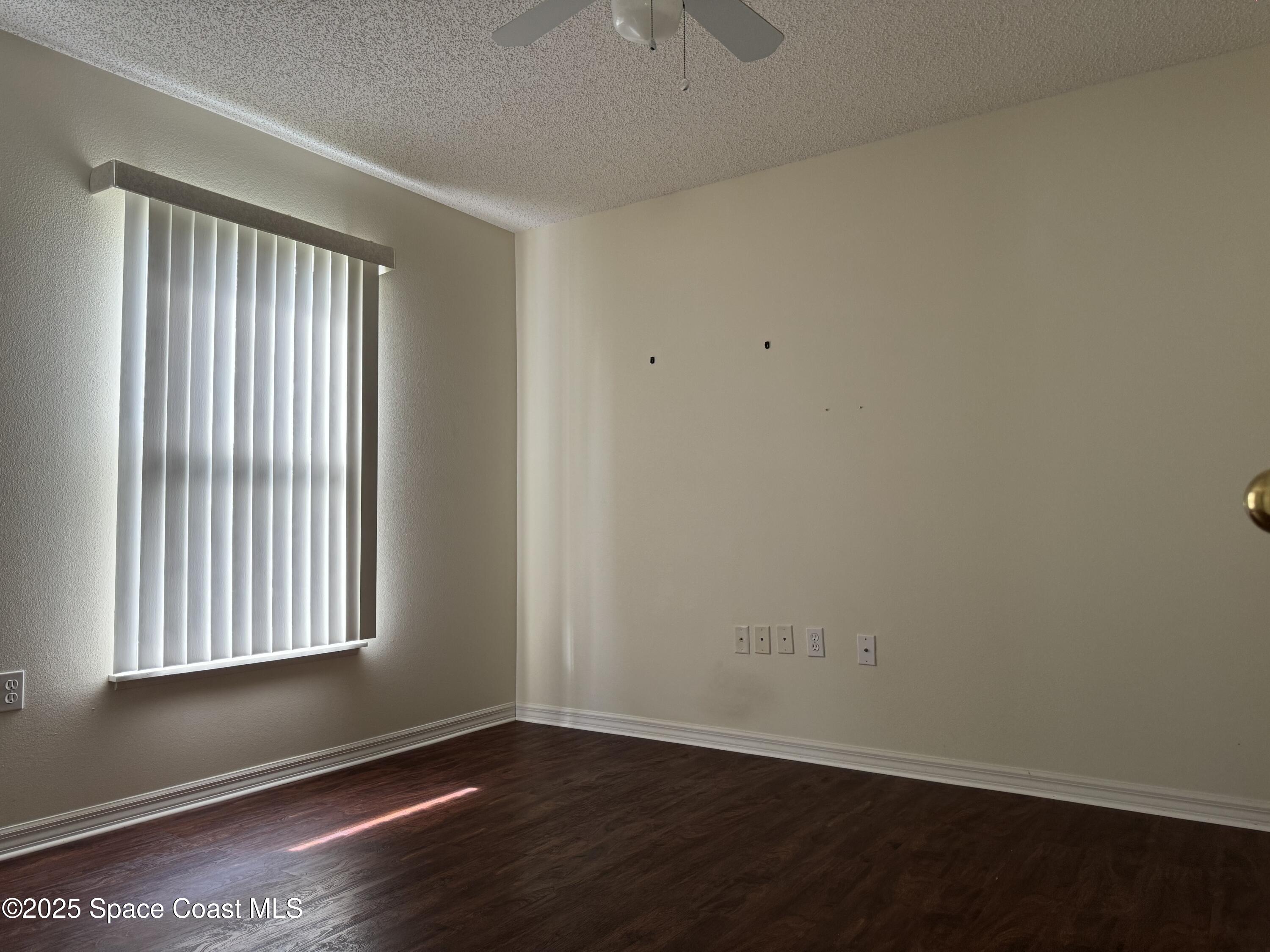 Undisclosed Address Palm Bay, FL 32909 - Photo 12 of 20 an empty room with wooden floor and windows
