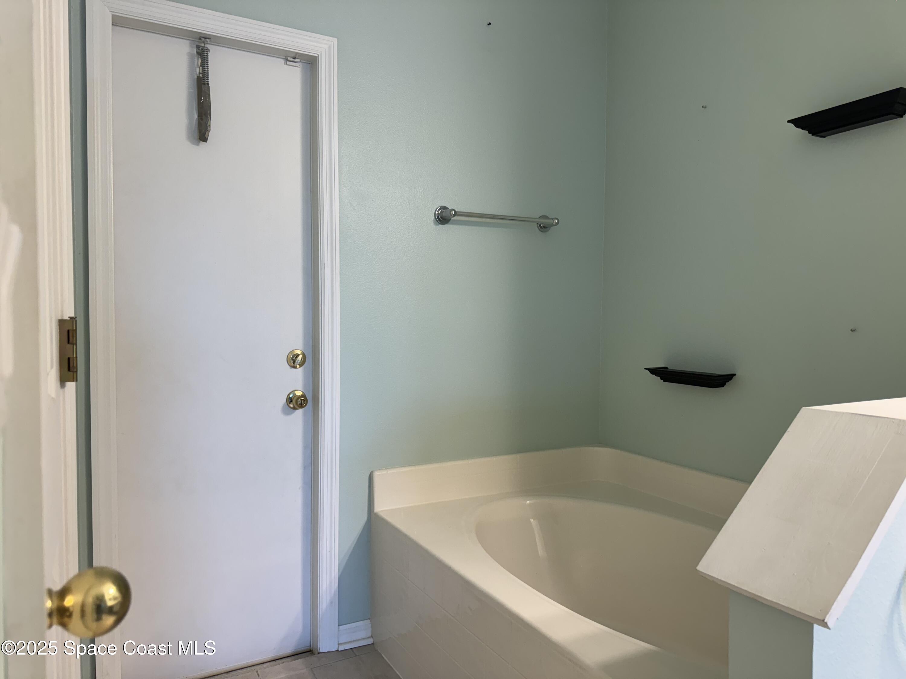 Undisclosed Address Palm Bay, FL 32909 - Photo 15 of 20 a bathroom with a bathtub