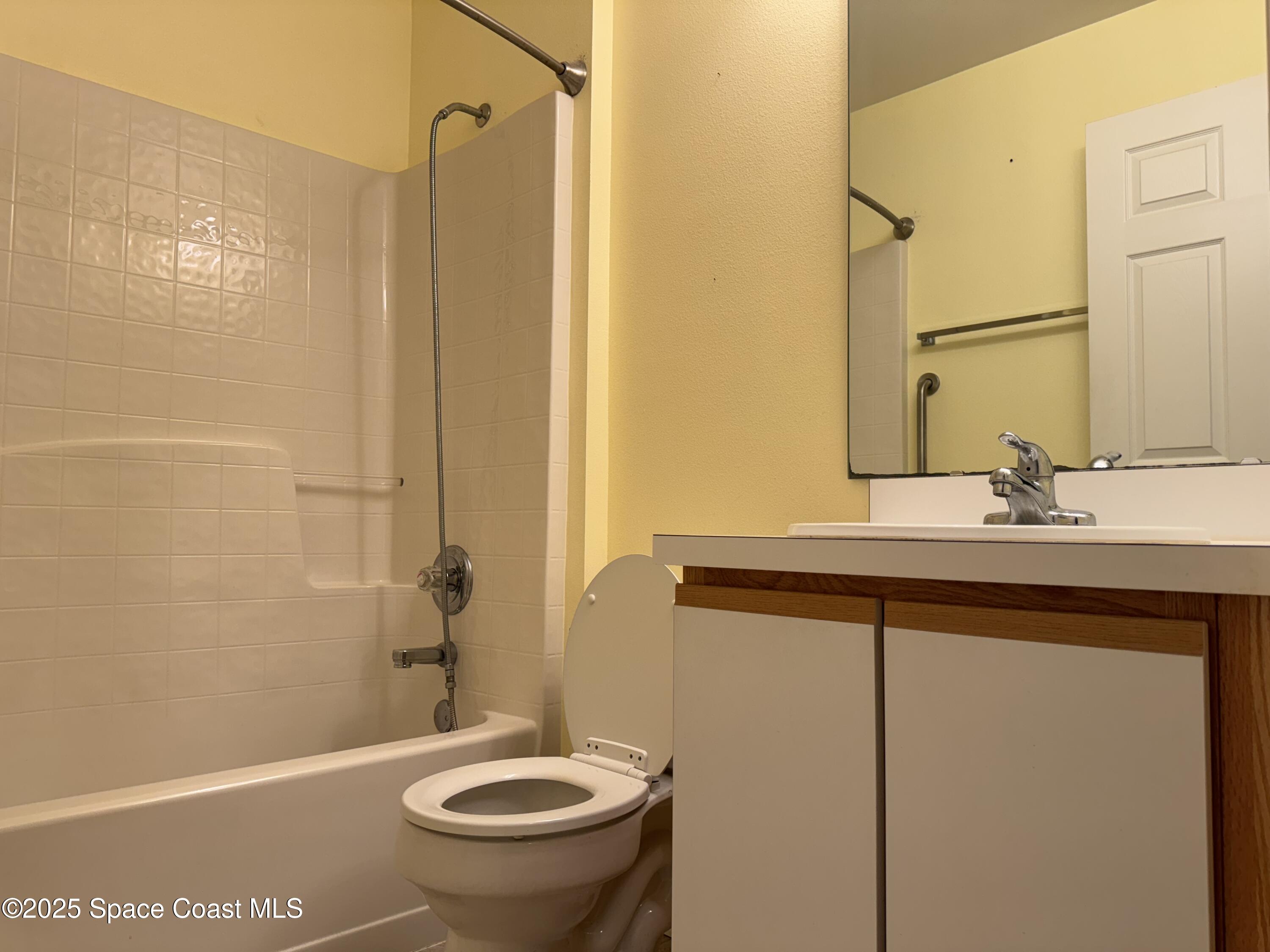Undisclosed Address Palm Bay, FL 32909 - Photo 16 of 20 a bathroom with a sink a toilet and shower
