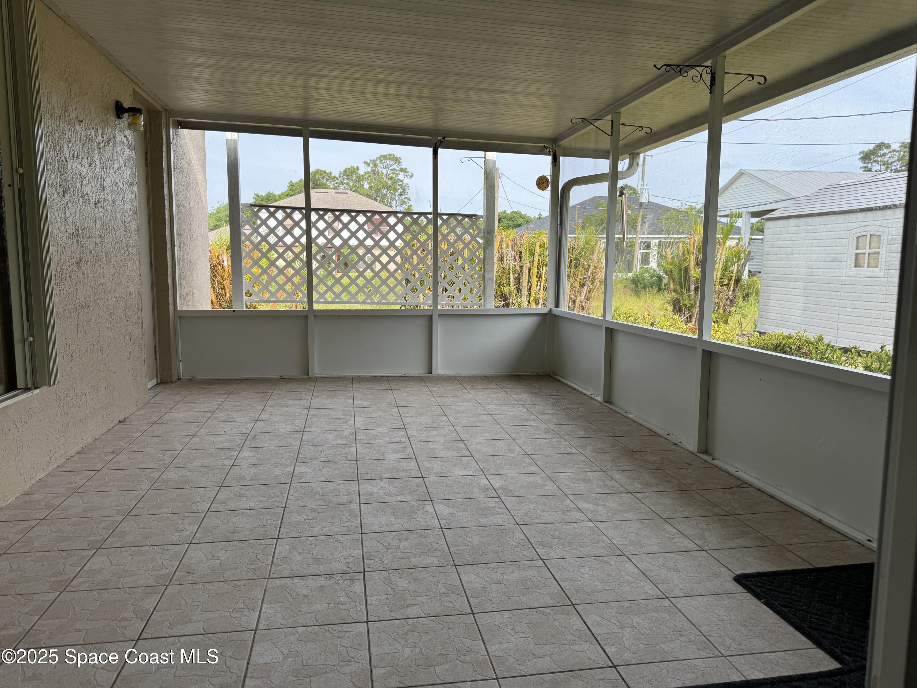 Undisclosed Address Palm Bay, FL 32909 - Photo 17 of 20 a view of an empty room with a window