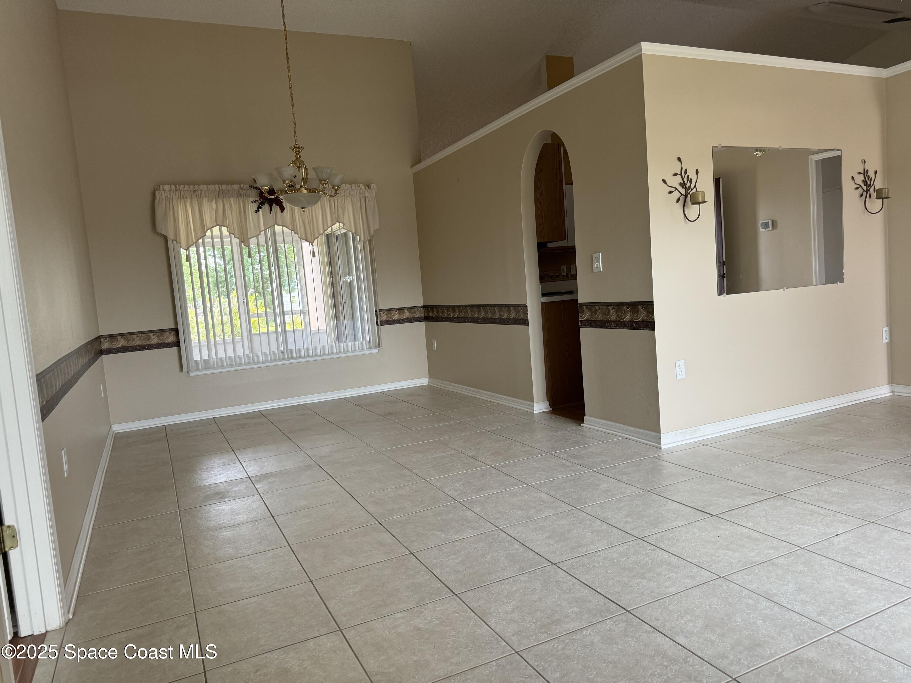 Undisclosed Address Palm Bay, FL 32909 - Photo 7 of 20 a view of an empty room with a window