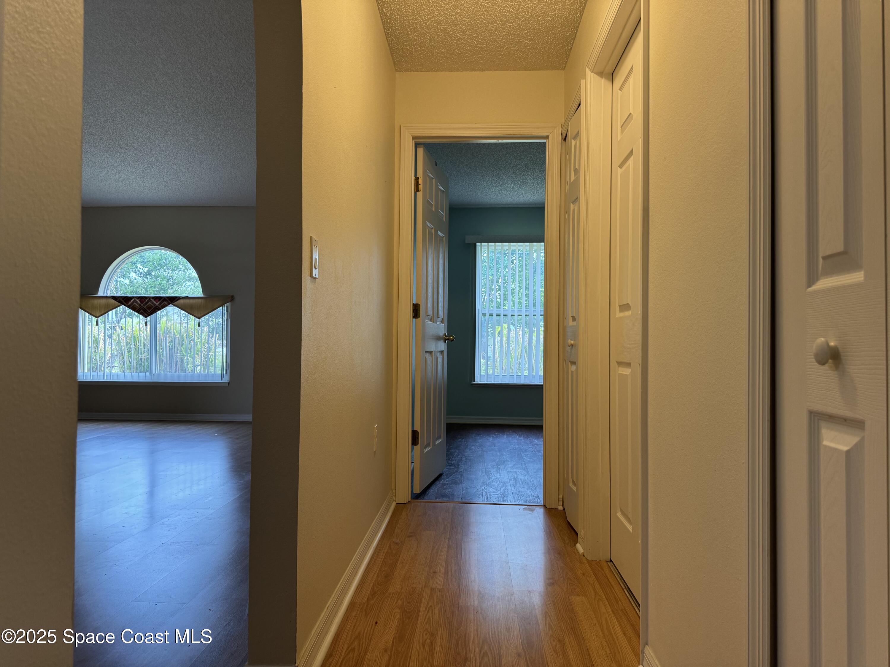 Undisclosed Address Palm Bay, FL 32909 - Photo 9 of 20 a view of a hallway with wooden floor