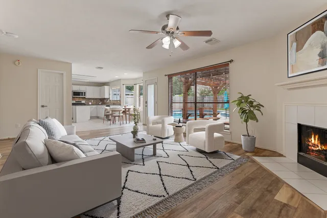 a living room with furniture and a fireplace