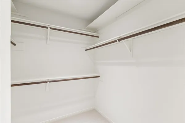 a view of an empty walk in closet